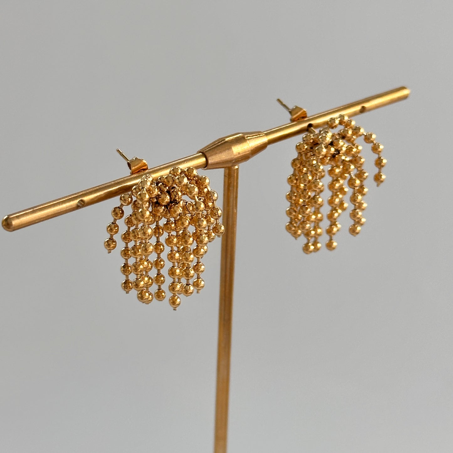 Polished bead fringed earrings
