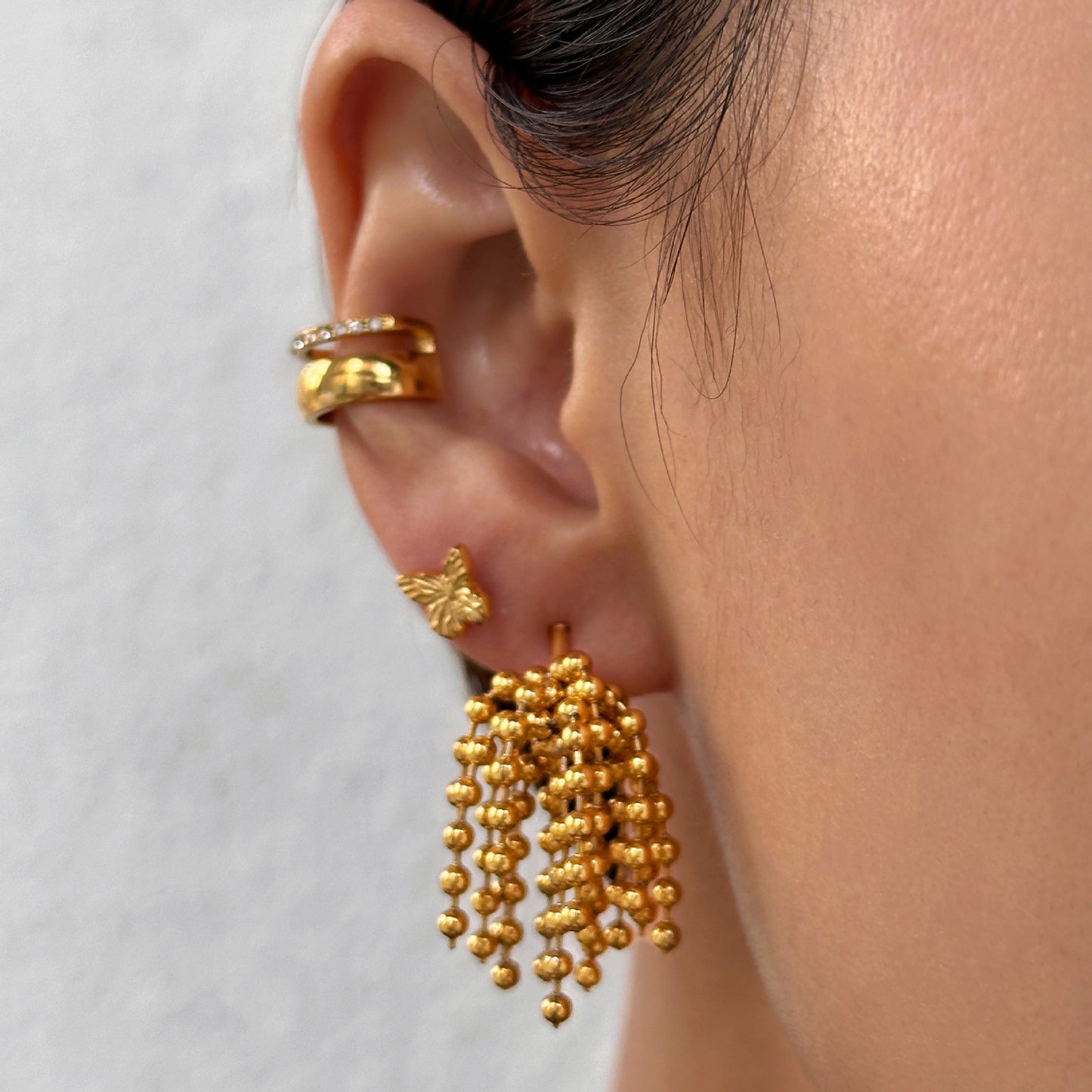 Polished bead fringed earrings