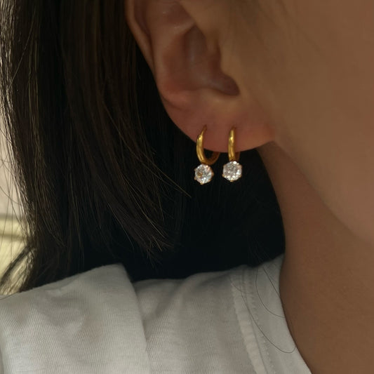 Small zircon pendant earrings with diamonds.